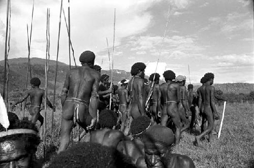 Men going to dance at an Etai