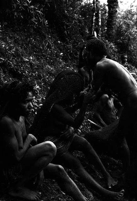 People greeting in the forest