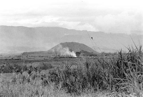 View of a distant fire, from a garden in Alima