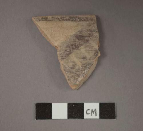 Ceramic rim sherd, black painted designs on exterior