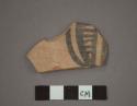 Ceramic body sherd, painted black linear designs on exterior