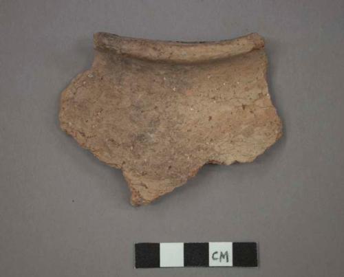 Ceramic rim sherd of jar, flared rim, course surface