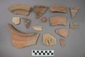 Rim and base sherds and one miniature jar, some sherds have painted designs