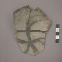 Ceramic base sherds of bowl? with black painted radial design, mended, will mend together