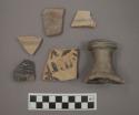 Ceramic body and rim sherds and one pedestal? sherd