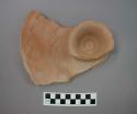 Ceramic sherd with cup-like feature, flat with lipped rim, incised wave lines