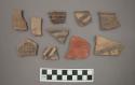 Ceramic body and rim sherds with painted designs, one sherd mended