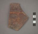 Ceramic body sherd, red pigment and ridged design on exterior