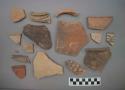 Ceramic rim and body sherds, many with painted designs