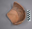 Fragments of jeddito black on orange pottery bowl
