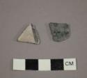 Ceramic body sherds with black designs on white exterior