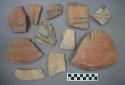 Ceramic body and rim sherds with painted designs, two sherds have raised features