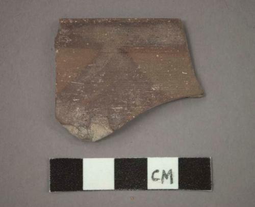 Ceramic rim sherd of bowl?, red painted designs on brown on exterior