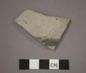 Ceramic body sherd, black painted design on exterior