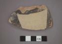 Ceramic body sherd of jar?, yellow and black painted design on exterior