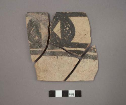 Ceramic rim and body sherds of bowl, black designs on white on exterior, will mend together