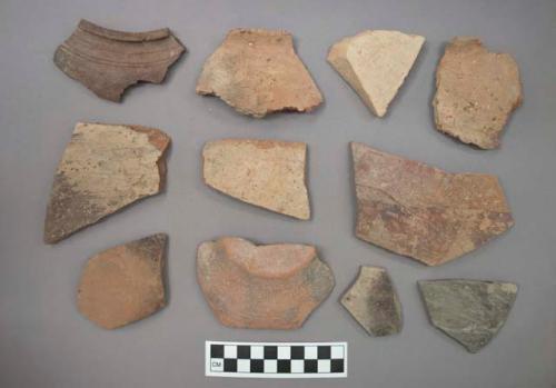 Ceramic sherds, plain or with painted designs or course or burnished