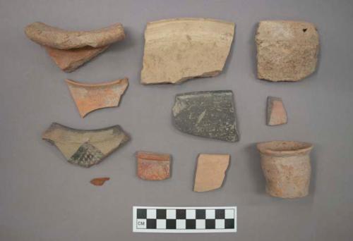 Ceramic bowl and jar sherds and one cup, some sherds have painted designs