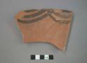 Ceramic rim sherd of bowl, black painted designs on interior