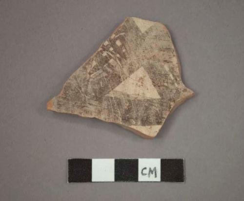 Ceramic body sherd, brown painted designs on buff on exterior