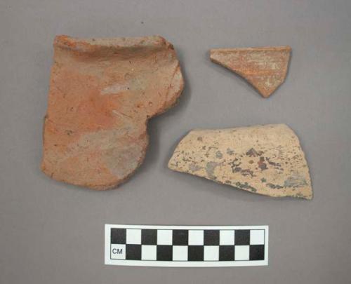 Ceramic rim or body sherds, at least one sherd with painted designs