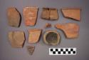 Ceramic sherds, some with painted designs, one sherd is mended