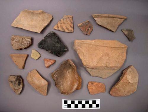 Ceramic sherds, plain or course, some with painted designs, some are burnished, at least one has designs in relief