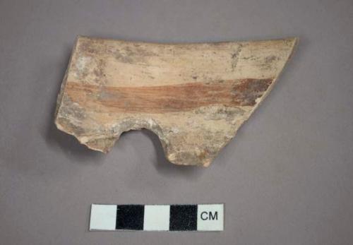 Ceramic rim sherd of bowl, red painted design on yellow