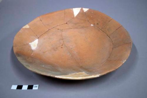 Undecorated pottery plate--restorable?