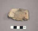 Ceramic rim sherd of sieve, curved, one partial perforation