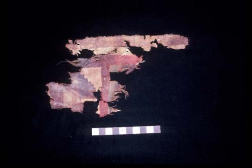 Textile fragment with red brown step fret design from Site 19