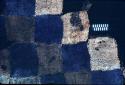 Textile with blue, brown and white checker board from Site 19