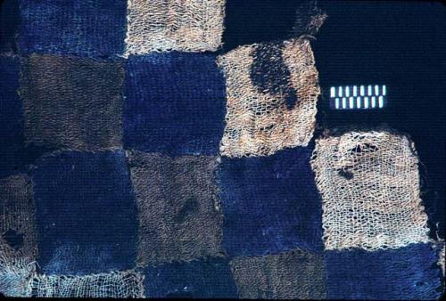 Textile with blue, brown and white checker board from Site 19