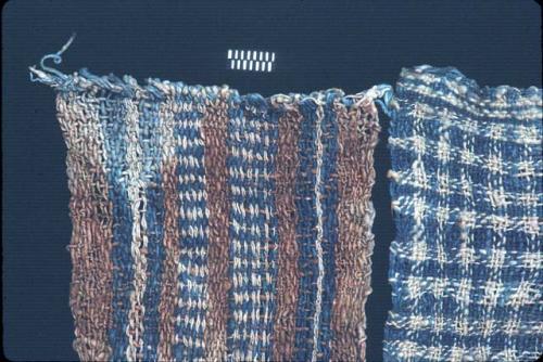 Blue and white plaid textile with brown, blue and white border from Site 19