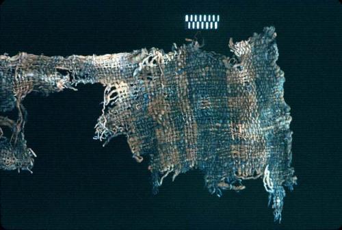 Coarse white textile fragment with blue stripes from Site 19