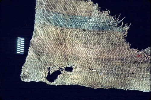 Corner of textile with blue stripe from Site 120