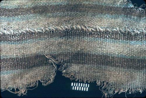 Textile with brown, blue and white stripes from Site 128