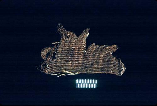 Brown textile edge fragment from Site 128