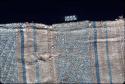 Textile with blue and brown complex design and stripes from Site 128