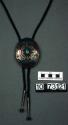 Bolo tie of silver concha set with turquoise and coral chipped inlay