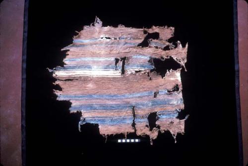 Textile fragment with blue and white stripes on brown from Site 120