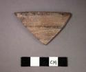 Ceramic rim sherd of bowl?, black painted lines on exterior and rim edge