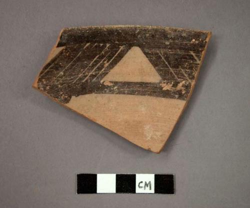 Ceramic rim sherd of bowl, black designs on interior, buff pigment on exterior