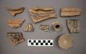 Ceramic rim sherds, one base sherd, one body sherd, and one fragment of spout, some sherds have painted designs on exterior, two sherds are mended