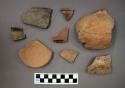 Ceramic sherds and one mended partial jar, many of the sherds have pigment