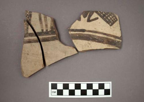 Ceramic body sherds, black designs on buff on exterior, two sherds will mend together