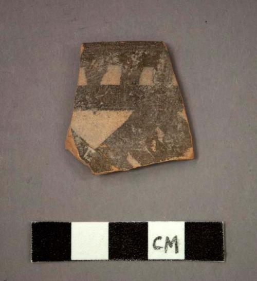 Ceramic rim sherd of bowl?, black painted designs on buff on exterior