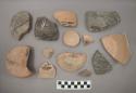 Ceramic base sherds, plain or burnished, at least one sherd has painted designs, some mended