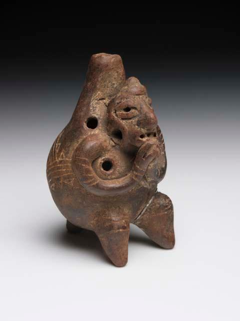 Four hole ocarina,  grotesque human form