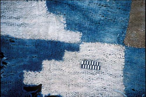 Detail of textile with blue and brown escalonado from Site 19